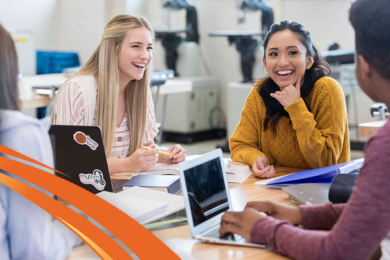 three students smiling