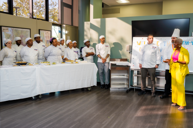 KCC alum Chef Shelly Flash '15 shares advice and inspiration during Chef Michael DiGiovanni's catering class's practical exam that also served as an after-hours networking event with local business leaders.